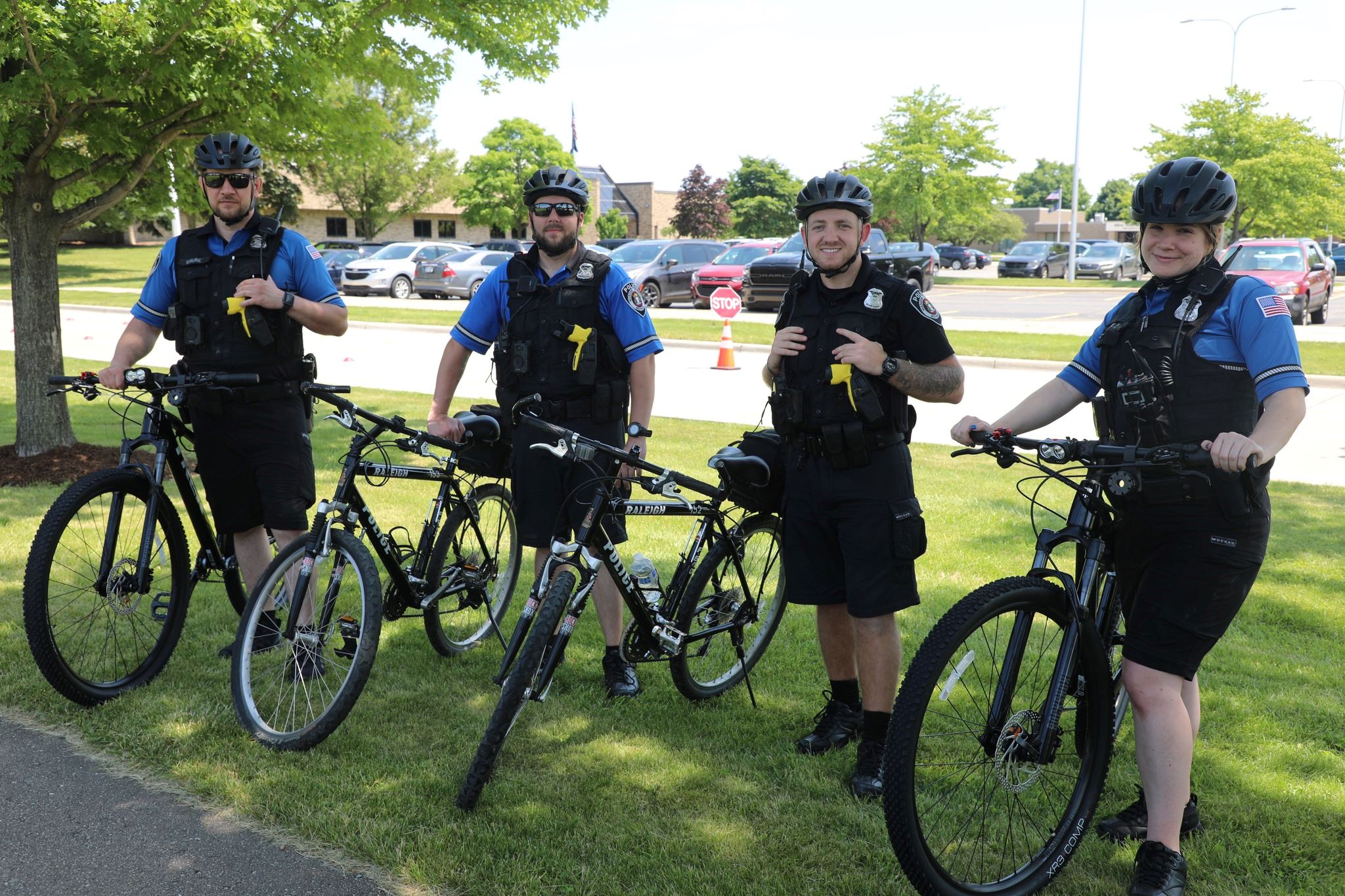 Four Officers outside on Bikes